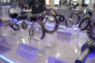 Components are displayed at a kiosk of HiCal that make electro-mechanical and electro-magnetics parts for airplanes, during the 