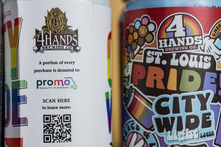 Cans of two Pride-themed beers, which the brewery is donating $1 for each sale of, at 4 Hands Brewing Company  in St. Louis, June 6, 2025. (Whitney Curtis/The New York Times)