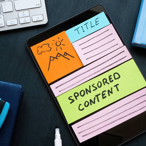 A Tablet with sponsored content as part of site. Digital marketing concept.