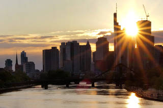 FILE PHOTO: The skyline of the banking district is seen during sunset in Frankfurt