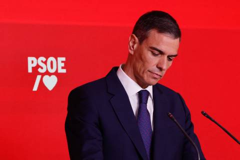Spain's Prime Minister and ruling Socialist Party (PSOE) leader, Pedro Sanchez, looks down during a press conference at the PSOE headquarters in Madrid, on June 12, 2025. Santos Cerdan, a top official in Spain's ruling Socialist Party, resigned on Thursday after being implicated in a widening corruption probe that has already ensnared the prime minister's former close aide. The investigation centres on public procurement of medical equipment during the early months of the Covid-19 pandemic.  (Photo by OSCAR DEL POZO / AFP)