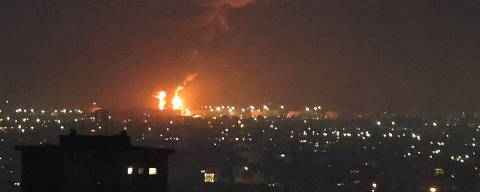 Flames from a fire at the Tehran oil refinery, located south of the capital, are seen burning in the distance on June 15, 2025. A series of blasts were heard in Tehran at around 2:30 am (2300 GMT) June 15, but the origin was not immediately known, as Iran and Israel exchange drone and missile fire.
Iran's Revolutionary Guards said early Sunday that the country had struck sites used by Israeli warplanes for refuelling, in retaliation for strikes carried out by Israel since Friday. (Photo by ATTA KENARE / AFP) ORG XMIT: AK4567