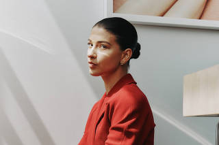 Phoebe Gates, in vintage Chanel, at the offices of Phia, a web browser/app that aims to be the Booking.com of fashion, in New York, April 19, 2025. (Alexandra Genova/The New York Times)