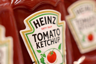 FILE PHOTO: Bottles of Heinz Ketchup are displayed on a shelf in a supermarket