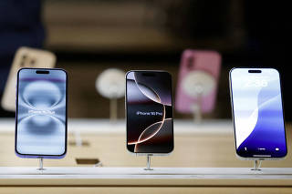 FILE PHOTO: A view of Apple iPhones displayed at an Apple Store at Grand Central Terminal in New York