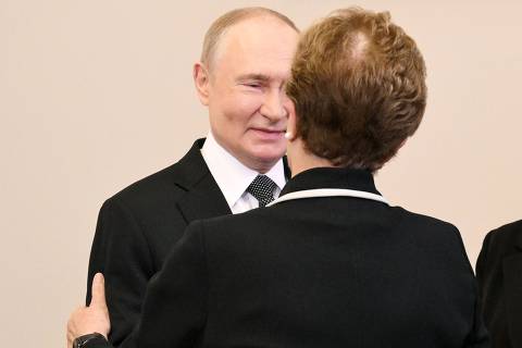 In this pool photograph distributed by the Russian state agency Sputnik, Russia's President Vladimir Putin reacts as he meets Dilma Rousseff, Chair of the New Development Bank and former president of Brazil, on the sidelines of the Saint Petersburg International Economic Forum (SPIEF) in Saint Petersburg on June 18, 2025. The 28th edition of Saint Petersburg International Economic Forum (SPIEF) takes place from 18th to 21st of June, 2025, at the ExpoForum Convention and Exhibition Centre in Saint Petersburg, on June 18, 2025. (Photo by Alexey DANICHEV / POOL / AFP) ORG XMIT: 453a1431735513d3