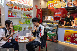 Students at a Mixue, now the worldÕs biggest fast-food chain, which said that it would hire thousands of people in Brazil and incorporate Brazilian ingredients into its products in China, in Beijing, Sept. 28, 2023. (Gilles Sabri/The New York Times)