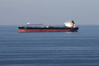 FILE PHOTO: Oil tankers pass through the Strait of Hormuz