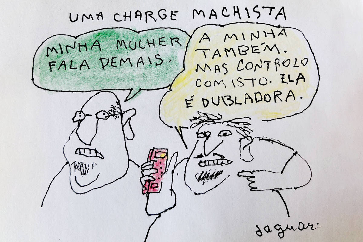 A imagem é uma charge que retrata dois homens conversando. O primeiro homem diz: 'Minha mulher fala demais.' O segundo homem responde: 'A minha também, mas controlo com isto. Ela é dubladora.' A charge é desenhada de forma simples, com traços em preto e cores suaves, e tem o título 'UMA CHARGE MACHISTA' no topo.