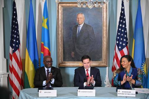 (L-R) US Secretary of State Marco Rubio Democratic Republic of the Congo Foreign Minister Thérèse Kayikwamba Wagner and Rwandan Foreign Minister Olivier Nduhungirehe applaud after signing a peace agreement during a ceremony at the State Department in Washington, DC, on June 27, 2025. Rwanda and the Democratic Republic of Congo will sign an agreement in Washington on Friday to put an end to a conflict in the eastern DRC that has killed thousands, although broad questions loom on what it will mean. Trump has trumpeted the diplomacy that led to the deal and publicly complained that he has not received a Nobel Peace Prize. But the agreement has also come under scrutiny for its vagueness including on the economic component, with the Trump administration eager to compete with China and profit from abundant mineral wealth in the long-turbulent east of the vast DRC. (Photo by Mandel NGAN / AFP)