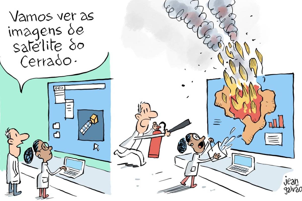 A charge é dividida em dois quadros.  No primeiro, dois cientistas, um homem e uma mulher, estão em um laboratório diante de uma grande tela de computador. O homem diz: “Vamos ver as imagens de satélite do Cerrado.”  A tela mostra um ícone de satélite.    No segundo quadro, os dois cientistas aparecem desesperados. A imagem de satélite projetada na tela agora mostra o mapa do Brasil, com destaque para a região central (o Cerrado) completamente em chamas. O fogo e a fumaça saem da tela como se estivessem pegando fogo de verdade. A mulher tenta apagar o incêndio jogando um balde d’água e o homem corre com um extintor de incêndio.