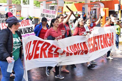 Demonstrators shout slogans at a rally by farmers and indigenous people during the third day of protests against the government of President Santiago Pena in Asuncion on March 27, 2025. (Photo by JOSE BOGADO / AFP)