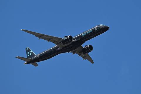 The Embraer E2 Profit Hunter E195-E2 takes part in an air display on the opening day of the Farnborough International Airshow 2024, south west of London, on July 22, 2024. (Photo by JUSTIN TALLIS / AFP)