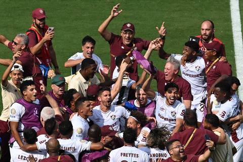 Fluminense players and staff celebrate after winning the FIFA Club World Cup 2025 round of 16 football match between Italy's Inter Milan and Brazil's Fluminense at the Bank of America Stadium in Charlotte on June 30, 2025. (Photo by Federico PARRA / AFP)