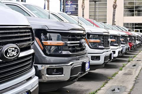 Ford trucks are seen at a car dealership in Montebello, California on May 5, 2025. As one of the 'Big Three' US auto manufacturers, Ford is due to report first quarter results revealing the impact of US President Trump's auto tariffs. (Photo by Frederic J. BROWN / AFP)