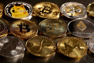 FILE PHOTO: Illustration shows representations of cryptocurrencies