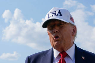 U.S. President Donald Trump boards Air Force One as he departs for Iowa, at Joint Base Andrews