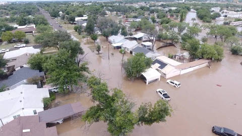 A drone view shows flooded houses, following torrential rains that unleashed flash floods along the Guadalupe River in San Angelo, Texas, U.S., June 4, 2025, in this screen grab obtained from a social media video. Patrick Keely via REUTERS    THIS IMAGE HAS BEEN SUPPLIED BY A THIRD PARTY. MANDATORY CREDIT. NO RESALES. NO ARCHIVES.     TPX IMAGES OF THE DAY ORG XMIT: GPD