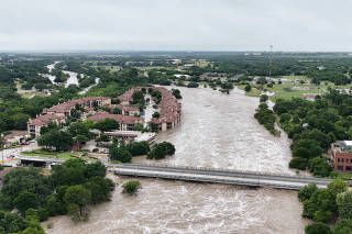 A drone view shows the swollen San Gabriel river, in Georgetown
