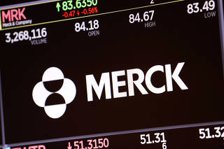 FILE PHOTO: The logo for Merck & Co. is displayed on a screen at the New York Stock Exchange (NYSE) in New York City
