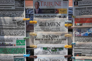 A general view of newspapers headlines, a day after the ceasefire announcement between India and Pakistan, at a stall in Islamabad
