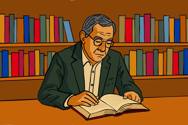 A imagem mostra um homem de óculos, com cabelo grisalho, lendo um livro em uma mesa. Ele está vestido com um paletó escuro e uma camisa clara. Ao fundo, há uma estante de livros coloridos, com volumes em várias cores dispostos de forma organizada. O ambiente é acolhedor e bem iluminado, sugerindo um espaço de leitura.