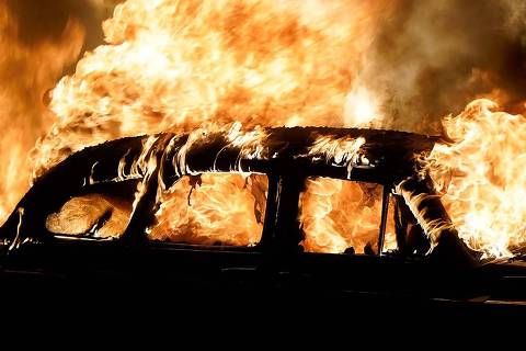 TOPSHOT - This handout photo taken and released by the Ukrainian State Emergency Service on July 12, 2025, shows a car burning following mass Russian strikes in the western Ukrainian city of Lviv, amid the Russian invasion of Ukraine. (Photo by Handout / Ukrainian State Emergency Service / AFP) / RESTRICTED TO EDITORIAL USE - MANDATORY CREDIT 