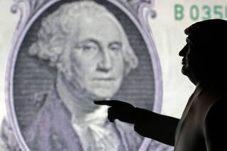 FILE PHOTO: Illustration shows 3D-printed miniature model depicting U.S. President Donald Trump and representation of U.S. dollar banknote