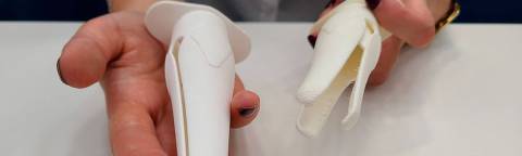 Dutch PhD candidate in industrial design engineering at TU Delft, Tamara Hoveling, holds Lilium, a prototype of a 3D-printed plastic alternative to the gynaecological speculum, in Deflft on July 1, 2025. Dutch PhD candidate in industrial design engineering at TU Delft, Tamara Hoveling, and her Spanish colleague Ariadna Izcara, an industrial designer, developed Lilium together as an alternative to the metal vaginal speculum. (Photo by Stéphanie HAMEL / AFP)