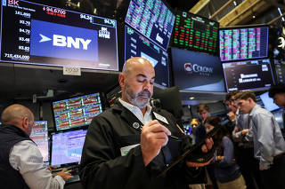 Traders work on the floorat the New York Stock Exchange (NYSE) in New York City