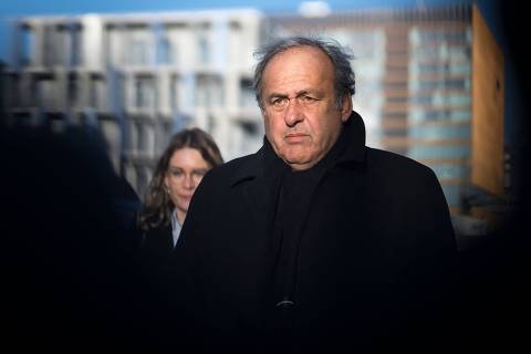 (FILES) Former UEFA president Michel Platini arrives at the court house in Muttenz near Basel for the opening of his trial before a special appeals court that will hear a request by the country's Attorney General's office (OAG) to reopen proceedings against Platini and former FIFA president after they were acquitted by the Swiss Federal Court in June 2022 of charges that included 