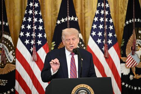 US President Donald Trump speaks before signing the GENIUS Act (Guiding and Establishing National Innovation for US Stablecoins Act), which codifies the use of stablecoins -- cryptocurrencies pegged to stable assets like the US dollar or US bonds -- in the East Room of the White House in Washington, DC, on July 18, 2025. (Photo by Brendan SMIALOWSKI / AFP)