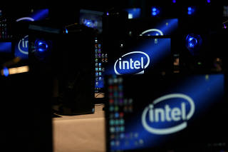 FILE PHOTO: The Intel logo is displayed on computer screens at SIGGRAPH 2017