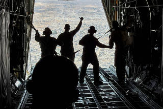 Jordanian military personnel air drop aid parcels over Gaza