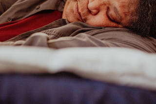 A woman sleeps in Brooklyn, March 1, 2024. (Laila Stevens/The New York Times)