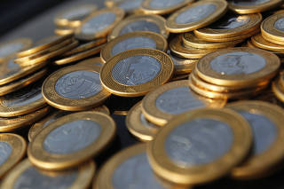 Imagem ilustrativa de moedas de 1 real