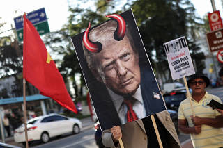 FILE PHOTO: People protest against tariffs imposed by Trump on Brazil