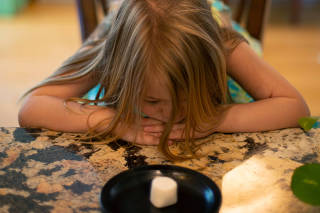 Young child sitting at a table