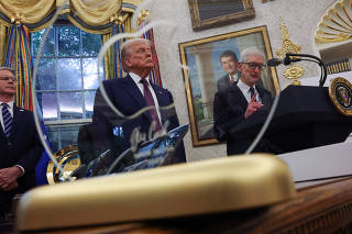 U.S. President Trump and Apple CEO Cook announce Apple's $100 billion investment in U.S. manufacturing, at the White House