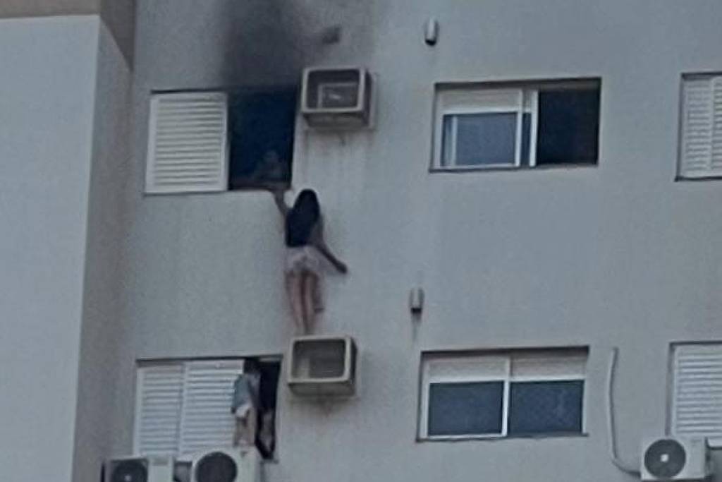 Mulher se pendura em ar-condicionado para escapar de incêndio em prédio de Cascavel (PR)