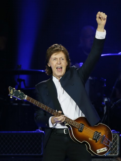(FILES) This file photo taken on June 11, 2015 shows British musician and former Beatles' member Paul McCartney performs  at the Stade de France in Saint-Denis near Paris.   The Beatles were masters of concise yet catchy songs and now Paul McCartney is writing tunes that are even more succinct -- to accompany emojis. The former Beatle announced February 10, 2016 that he has written a series of sounds to go with emojis on video chat service Skype, mostly designed for Valentine's Day messages.  / AFP / PATRICK KOVARIK ORG XMIT: 7709