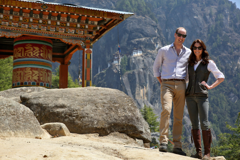Britain's Prince William, Duke of Cambridge poses with his wife Catherine, Duchess of Cambridge in front of the Paro Taktsang Monastery