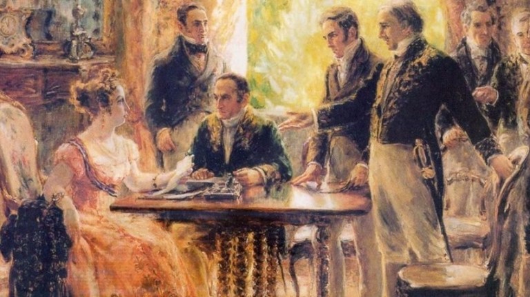 a tela mostra uma reunião com a princesa leopoldina, sentada ao canto da mesa, josé bonifácio, em pé, em frente à princesa, e demais ministros de dom pedro